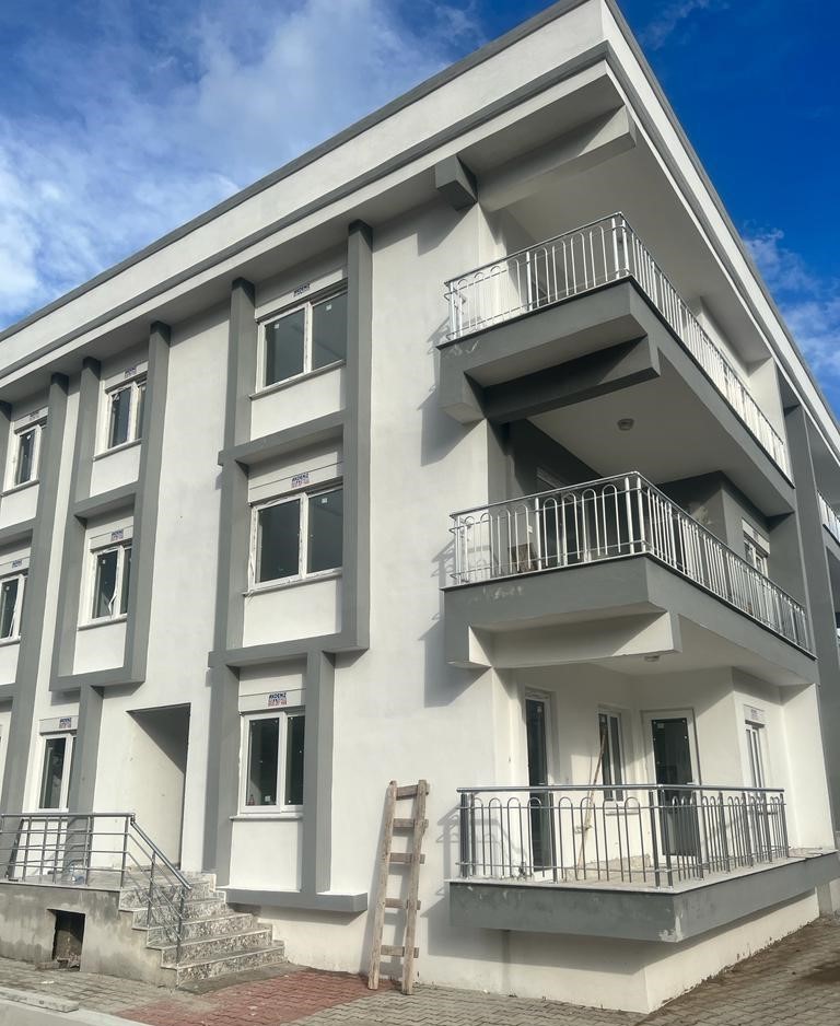 Three-room apartment in a new building in the charming town of Finike. Suitable for residence permit